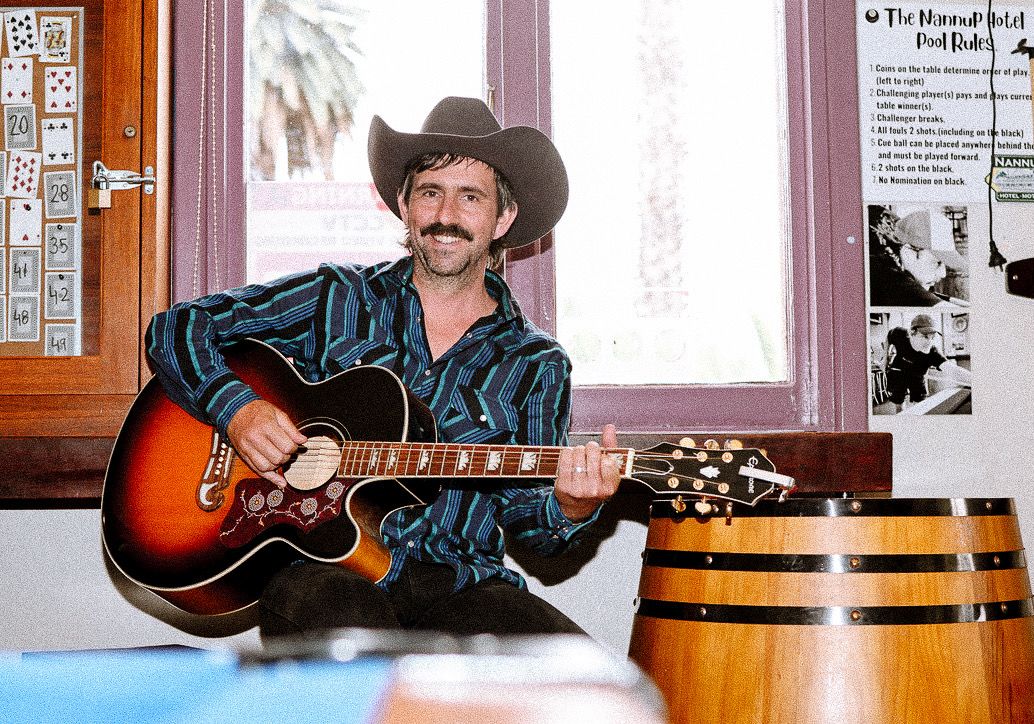 Dave Kent playing guitar at the Nannup Hotel
